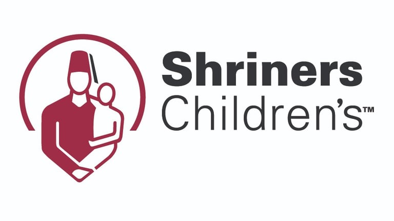 Shriners Children's TM logo with 3/4 circle and person wearing a fez hat holding smaller person