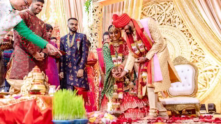 Indian Groom and Bride are offerings to holy fire