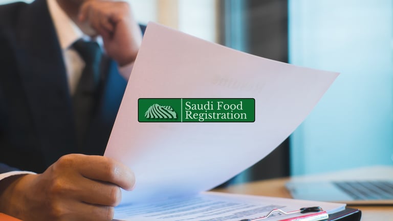 Saudi Food Registration Logo Overlaid, Consultant reviewing SFDA documents.