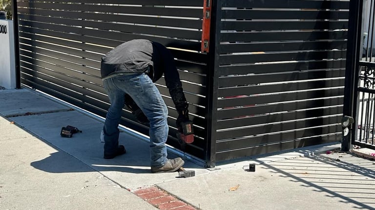 Garage Door Wizards team installing gate and fence