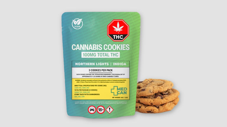 A package of Northern Lights indica cannabis cookies containing 100mg THC next to fresh chocolate chip edibles.
