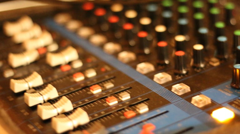 mixing board recording studio audio production knobs faders