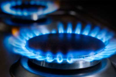 a blue flame burns brightly in the night