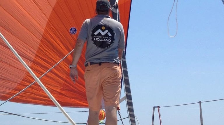 sailplan specailist checking the sails on a yacht