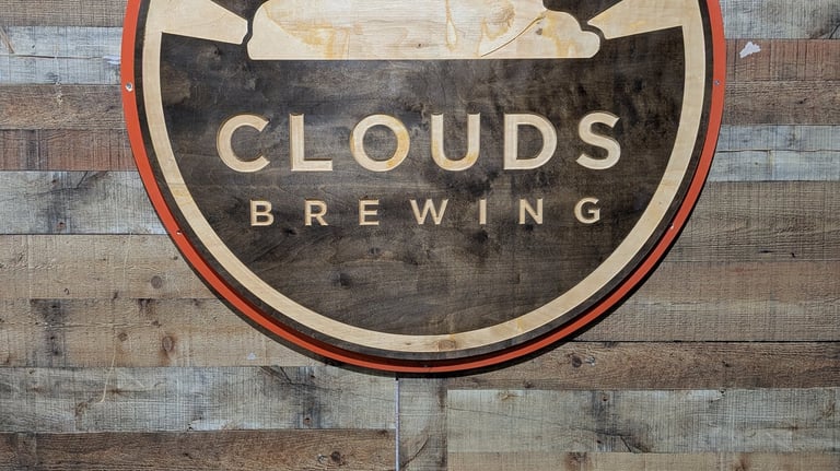 a sign that says clouds brewing
