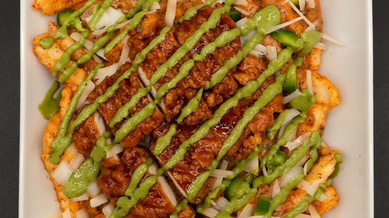 creamy cajun loaded fries with basil aioli