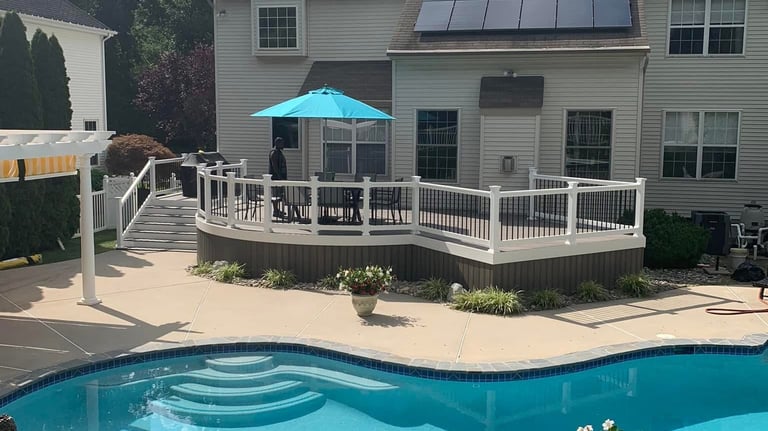 a pool with a blue umbrella and a blue umbrella