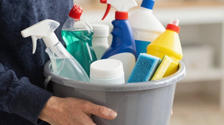 A professional cleaner carefully wiping a large office window.