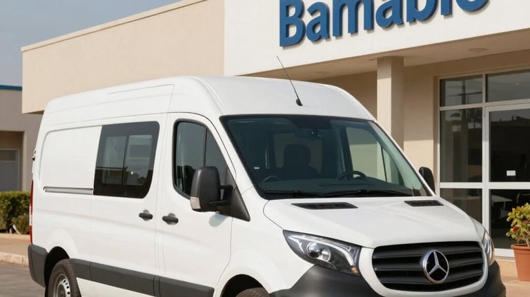 A white delivery van with subtle professional branding parked in front of a healthcare center in Bamako. Daytime, clear sky, professional logistics context.