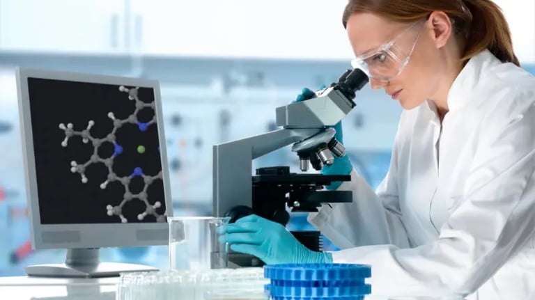 A female scientist in a white lab coat studies DNA in a microscope