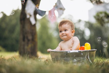 a baby in a tub tub with bubbles