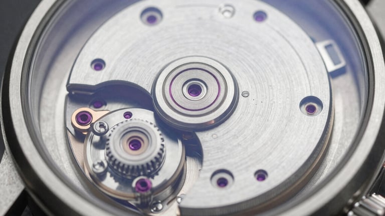 A close-up of a mechanical watch movement through a glass case, showcasing precision and the sophisticated discipline of high performance.