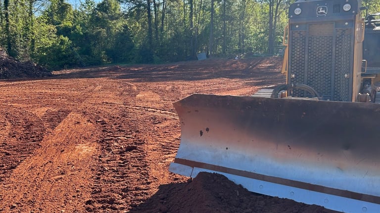Dozer grading building pad