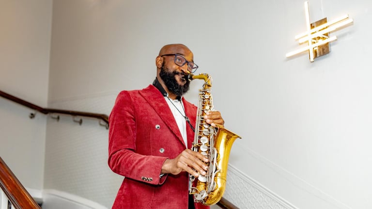 London saxophonist performer in red jacket with gold saxophone - professional music entertainment