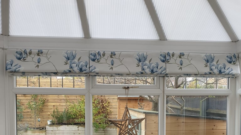3 roman blinds side by side with the pattern perfectly matched