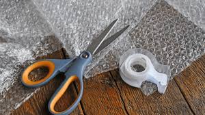 bubble wrap, scissors, and tape