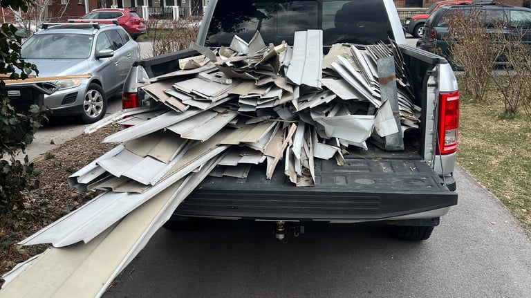 A truck bed filled with aluminum siding to be recycled 