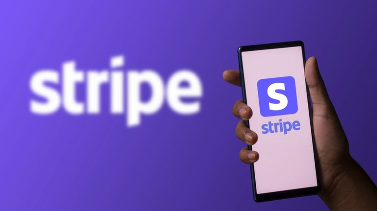 a person holding a phone with a logo on it