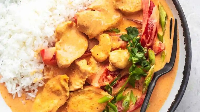 thm recipe chicken coconut curry in a bowl on marble