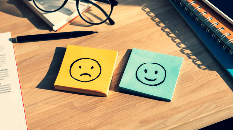 a note pad with a smiley face drawn on it