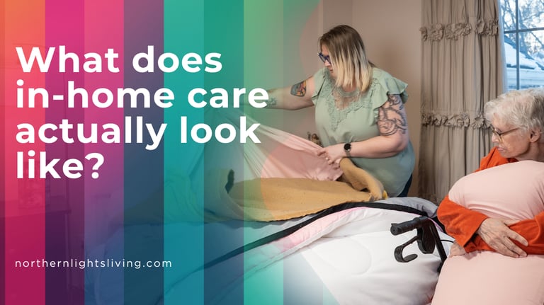 A female caregiver provides in-home care services by assisting a senior woman with making her bed.