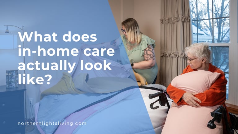 A professional caregiver providing in-home care services by making the bed for a senior woman in a wheelchair.