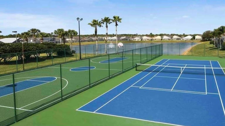 a tennis court with a basketball court at Hampton Lakes Florida