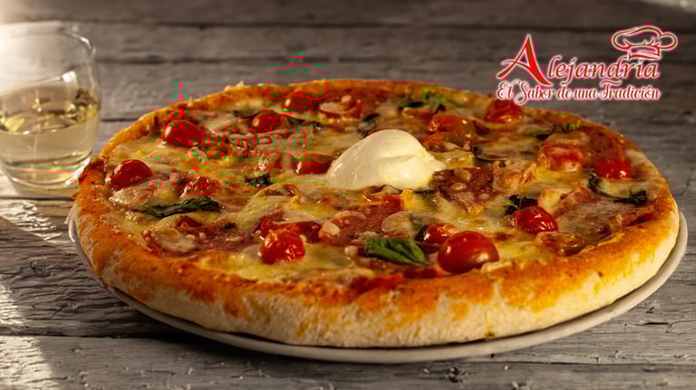 a pizza with cheese and tomatoes on a plate