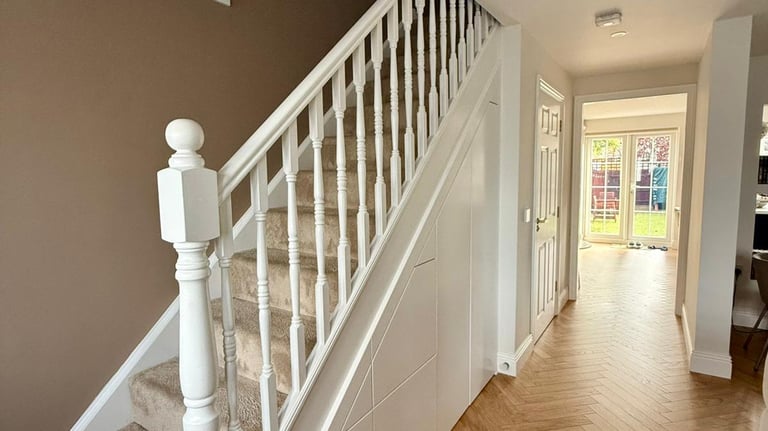 a staircase with a staircase and a couch