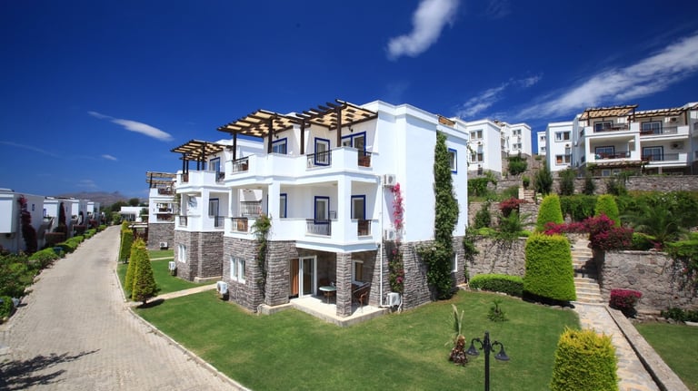 a large apartment complex with a driveway and a driveway