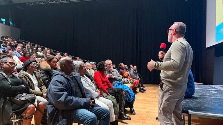 a man speaking to a crowd
