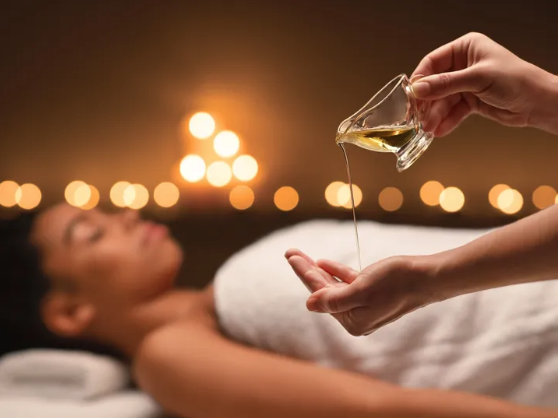 Someone pouring oil on their hand.