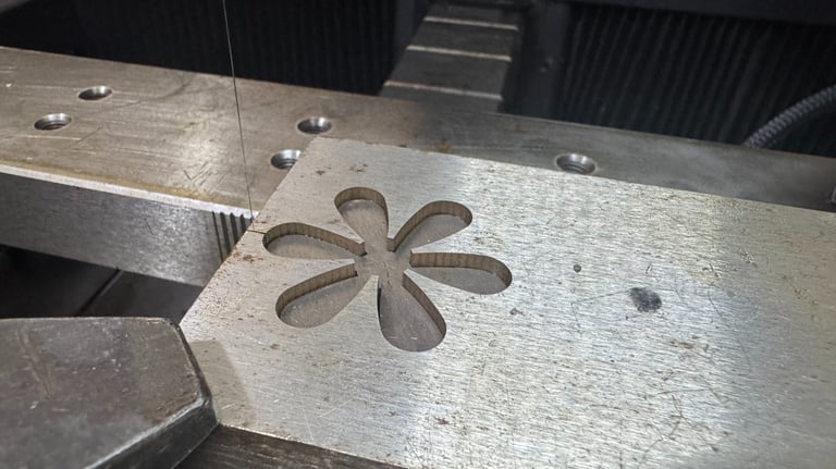 a metal object with a flower on it