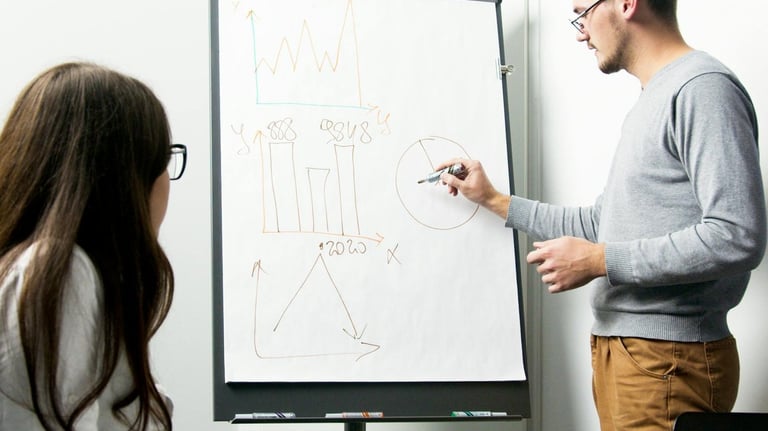 a man and woman in a meeting room