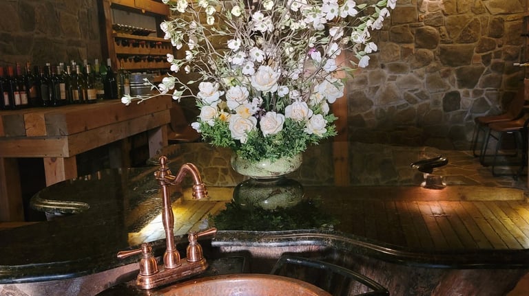 a rustic copper sink with a rustic copper sink
