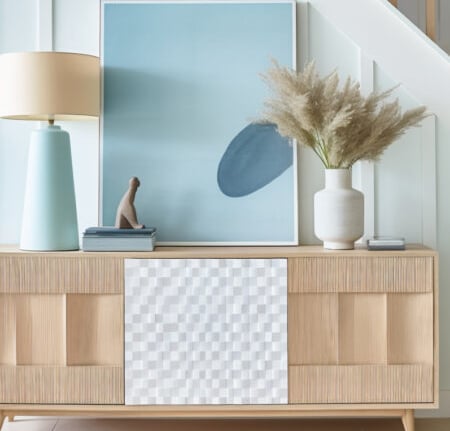 a picture of a dresser with a vase of flowers