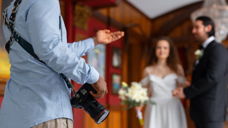 a man in a suit and tie is holding a camera