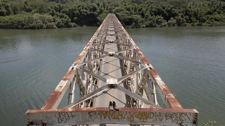 a train bridge with graffiti on it