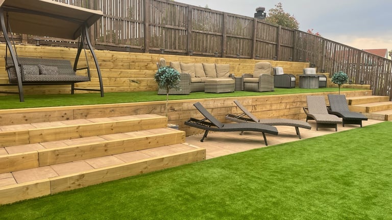 Garden with oversized stairs and double height retaining wall.