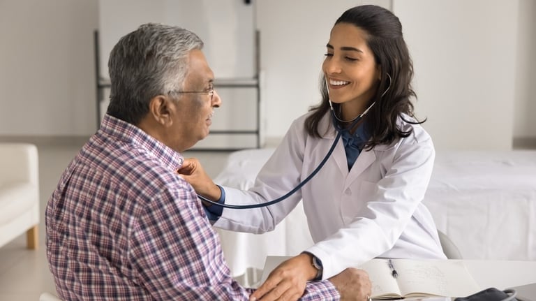 a doctor examining a patient's heartbeat