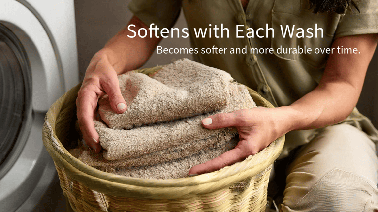a woman holding a basket with towels and towels