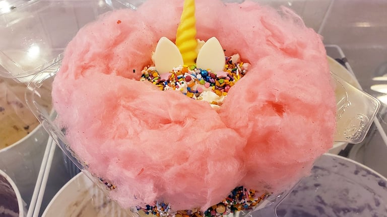 Ice cream cake with cotton candy and unicorn topping