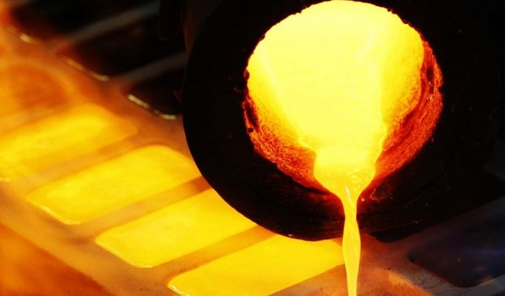 Molten gold being poured into molds for refining