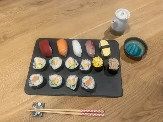 Small group sushi class at Atelier SUSHI Kyoto with host Kana guiding participants