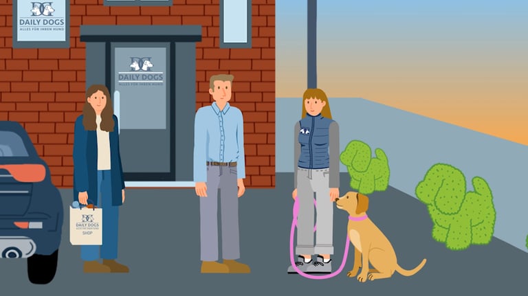 two dog owners pick up their dog, being delivered by a dog kennel worker in front of a building