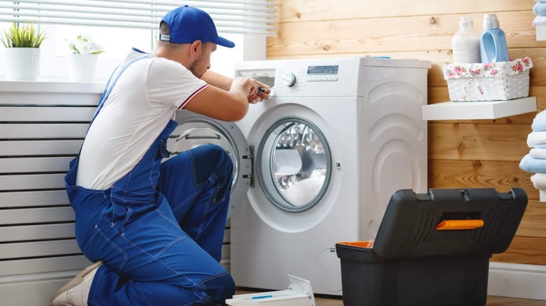 a person removing the front panel of a front load washer
