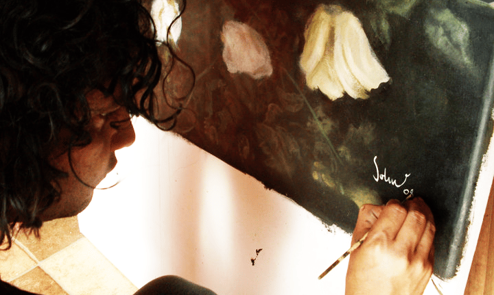 a man is painting a picture