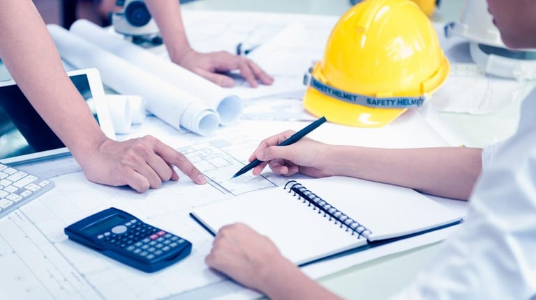 a team of professionals in hard hats and safety vests collabrating in a project