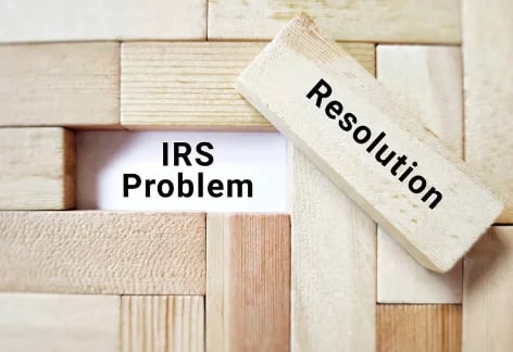 Side-by-side blocks with one labeled ‘Resolution' meant to cover the text, 'IRS Problem'.