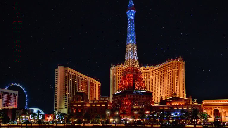 a cityscape of a city with a tower in the background